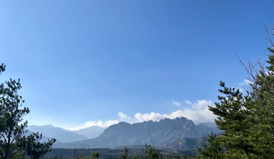 Scenic view of Ulsanbawi Rock in Seoraksan National Park, surrounded by dramatic granite peaks and lush mountain landscape