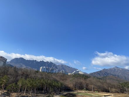 Scenic view of Ulsanbawi Rock in Seoraksan National Park, surrounded by dramatic granite peaks and lush mountain landscape