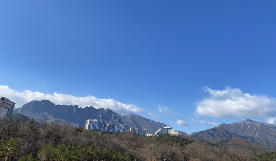 Scenic view of Ulsanbawi Rock in Seoraksan National Park, surrounded by dramatic granite peaks and lush mountain landscape