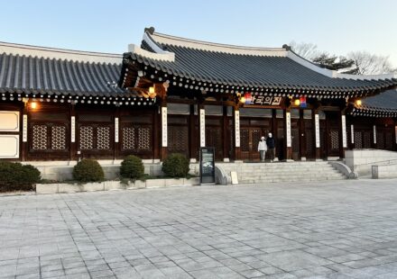 Main hanok building of Korea House illuminated at dusk in Seoul