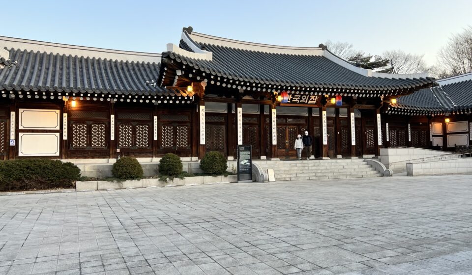 Main hanok building of Korea House illuminated at dusk in Seoul